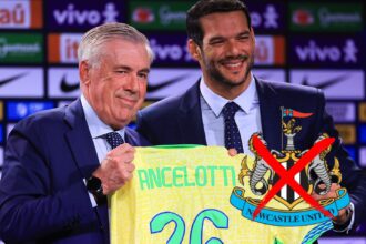Carlo Ancelotti poses after being announced as Brazil