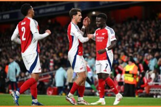 William Saliba celebrates with his Arsenal teammates