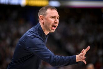 David Adelman is in honor of the Denver Nuggets legend, as he plays his role as a permanent head coach.