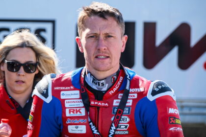Dean Harrison on the NW200 Superstock Race 2 podium "hanging there"