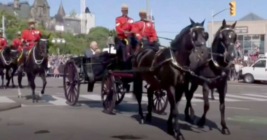 A carriage being pulled by black horses.