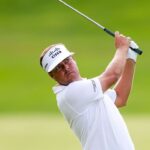 Keith Mitchell leads Trust after 61 course record. Loli 5 bags