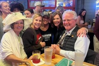 Mott celebrates the Kentucky Derby victory at his beloved local bar