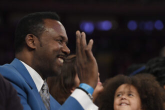 Roland Blackman films Nico Harrison for the NBA Draft Lottery