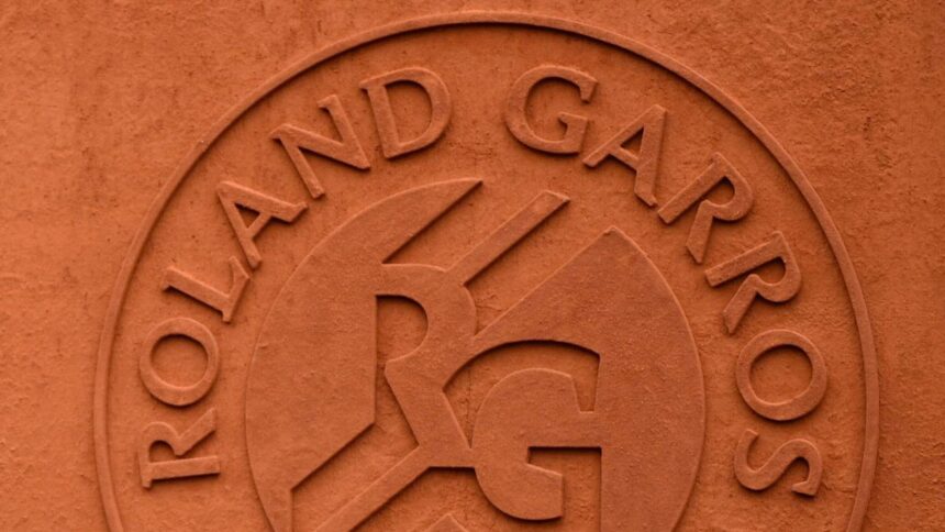 Former champion Henin presents French open trophy Agassi
