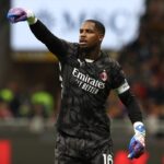 AC Milan goalkeeper Mike Maignan in action against Napoli