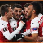 Aaron Ramsey celebrates with his Arsenal teammates in 2019