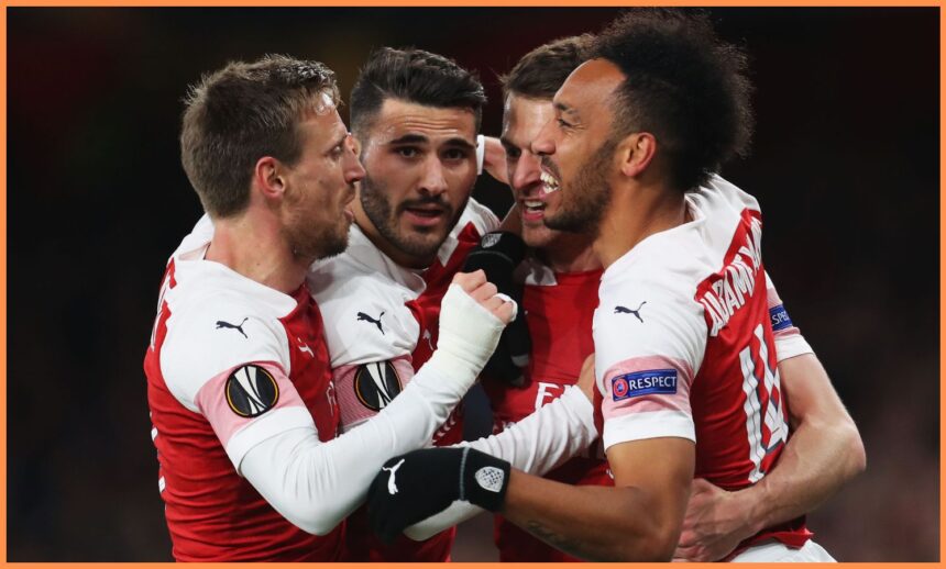 Aaron Ramsey celebrates with his Arsenal teammates in 2019
