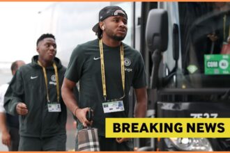 Christopher Nkunku getting off the Chelsea team bus