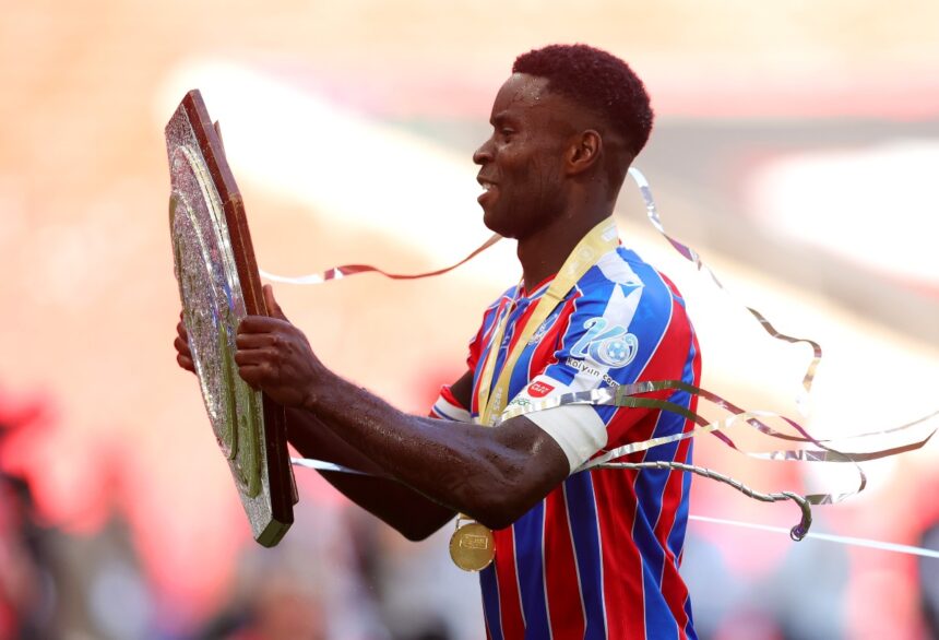 Marc Guehi lifts the Community Shield trophy
