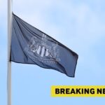 A Newcastle United flag and breaking news banner