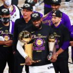 Shannon Sharp responds to the La Lakers title debate for "only reason," with LeBron James responding, "I promise...".