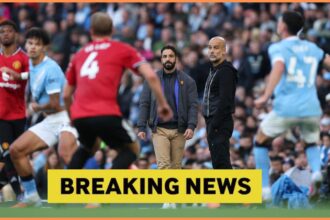 Ruben Amorim and Pep Guardiola look on during the Manchester Derby