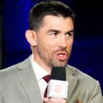 Dominick Cruz commentates cageside during a UFC event at the Apex