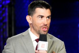 Dominick Cruz commentates cageside during a UFC event at the Apex