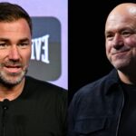 Eddie Hearn speaks at a press conference, opposite Dana White on stage at a media event