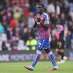 Marc Guehi applauds the Crystal Palace fans