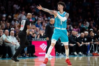 LaMelo Ball #1 of the Charlotte Hornets reacts during the first half of the game against the Brooklyn Nets at Spectrum Center.