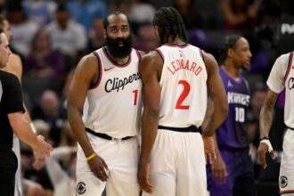 James Harden #1 and Kawhi Leonard #2 of the Los Angeles Clippers celebrate during the fourth quarter against the Sacramento Kings at Golden 1 Center on April 11, 2025 in Sacramento, California.