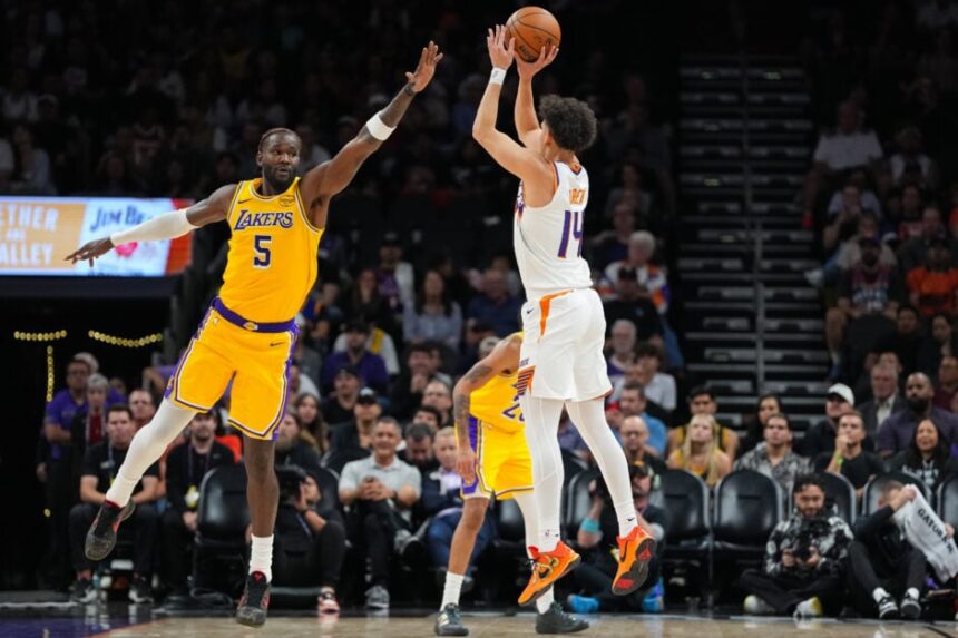 Deandre Ayton tries to block Coby Blair's shot, Los Angeles Lakers vs. Phoenix Suns.