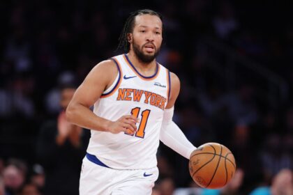 Jalen Brunson #11 of the New York Knicks dribbles during the second half of the game against the Charlotte Hornets at Madison Square Garden.