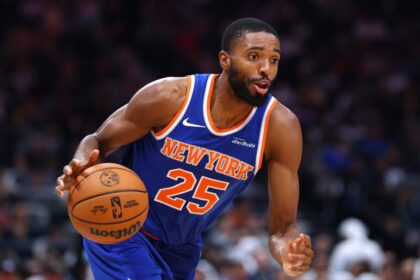 Mikal Bridges of the New York Knicks handles the ball during a preseason game between the Philadelphia 76ers and New York Knicks.