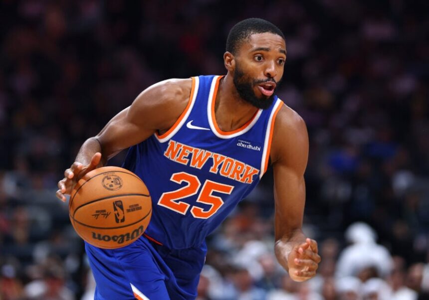Mikal Bridges of the New York Knicks handles the ball during a preseason game between the Philadelphia 76ers and New York Knicks.