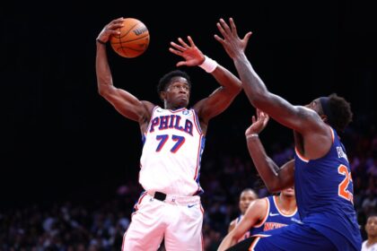 VJ Edgecomb, #77 of the Philadelphia 76ers, goes to the basket against Mitchell Robinson #23 of the New York Knicks during a preseason game between the Philadelphia 76ers and the New York Knicks.