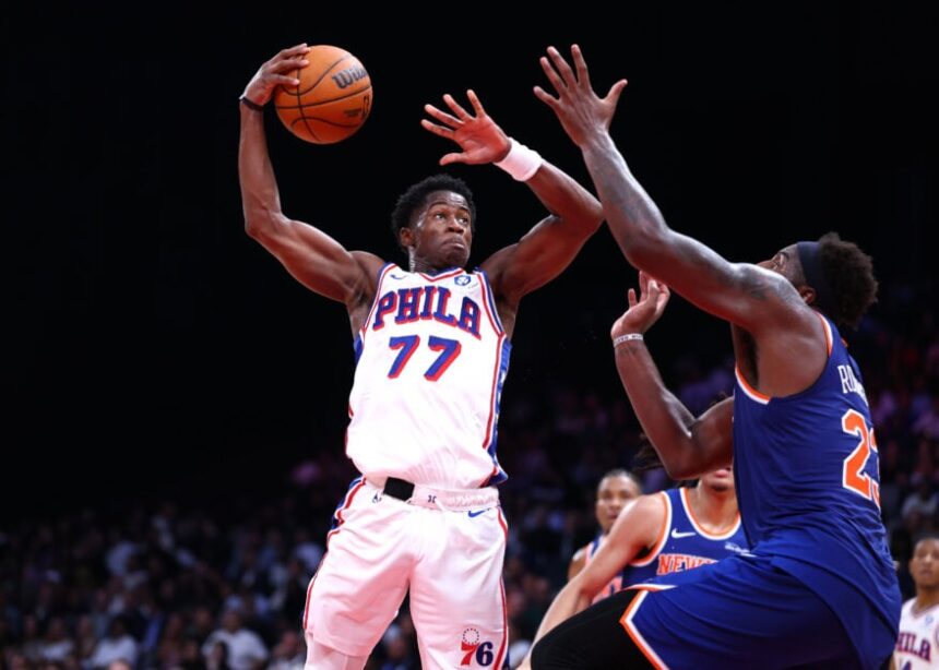 VJ Edgecomb, #77 of the Philadelphia 76ers, goes to the basket against Mitchell Robinson #23 of the New York Knicks during a preseason game between the Philadelphia 76ers and the New York Knicks.