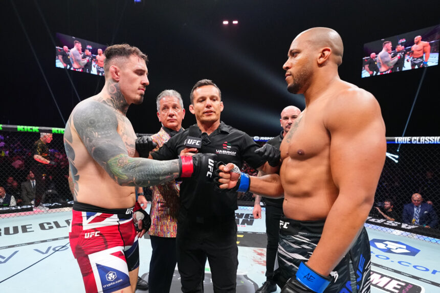 Tom Aspinall and Ciryl Gane fist bump at UFC 321
