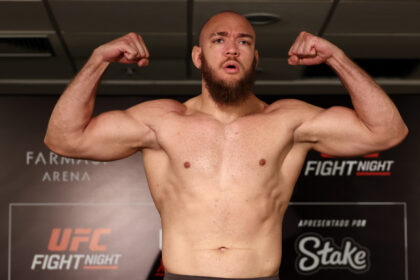 Valter Walker poses on the scale at the UFC Rio official weigh-in