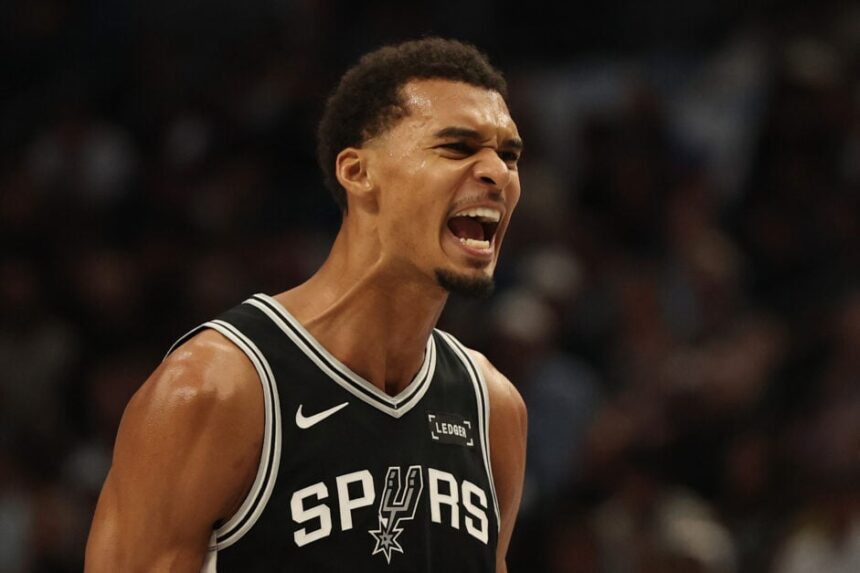 Victor Wembaneyama #1 of the San Antonio Spurs reacts to his first half score against the Dallas Mavericks at American Airlines Center.