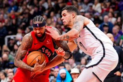 Brandon Ingram #3 of the Toronto Raptors dribbles against Michael Porter Jr. #17 of the Brooklyn Nets during the second half at Scotiabank Arena.