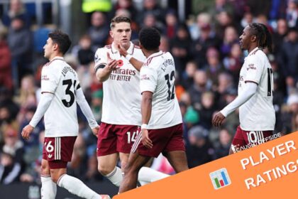 Arsenal players celebrating after scoring vs Burnley