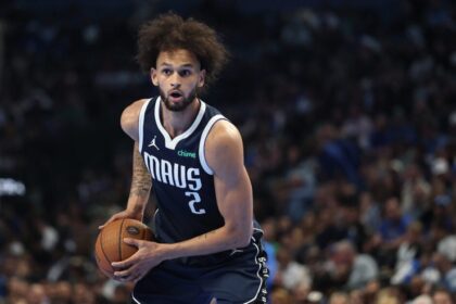 Derek Lively II #2 of the Dallas Mavericks handles the ball during the first half of the 2025-26 Emirates NBA Cup game against the Los Angeles Clippers at American Airlines Center.