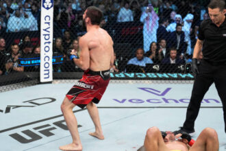Islam Makhachev celebrates victory at UFC 280