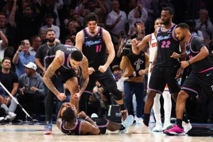 Miami Heat's Davion Mitchell #45, Keluel Ware #7, Jaime Jaquez Jr. #11, Andrew Wiggins #22, and Norman Powell #24 celebrate after defeating the New York Knicks at Caseya Center.