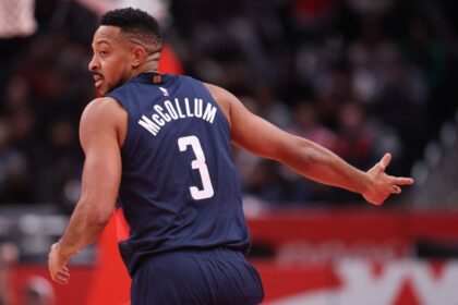 Washington Wizards #3 CJ McCollum celebrates his 3-point shot against the Atlanta Hawks during the first half of the Emirates NBA Cup game at Capital One Arena.