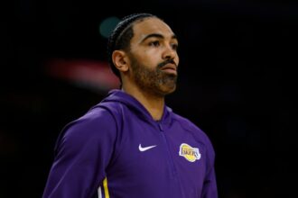 Gabe Vincent #7 of the Los Angeles Lakers during warm-ups before the season opener between the Golden State Warriors and Los Angeles Lakers on Crypto.com.