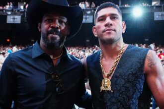 Alex Pereira and Jon Jones pose for a photograph at UFC 306