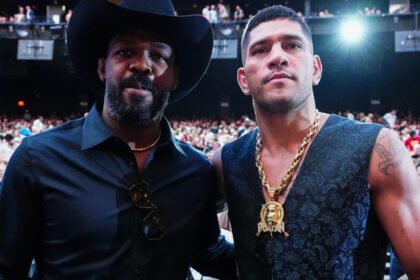 Alex Pereira and Jon Jones pose for a photograph at UFC 306