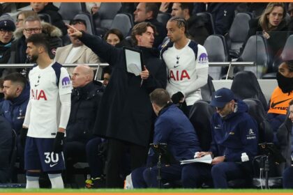 Tottenham manager Thomas Frank gives instructions to Xavi Simons