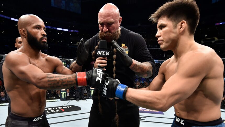 Demetrious Johnson and Henry Cejudo touch gloves just before their fight