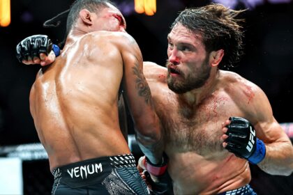 Ethyn Ewing and Malcolm Wellmaker trade punches during their fight at UFC 322