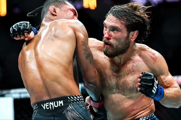 Ethyn Ewing and Malcolm Wellmaker trade punches during their fight at UFC 322