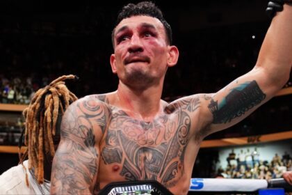 Max Holloway celebrates after his win over Dustin Poirier at UFC 318