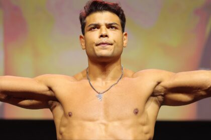 Paulo Costa poses on the scale at the UFC 318 ceremonial weigh-in