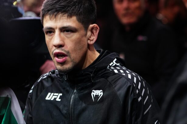 Brandon Moreno walks to the Octagon for his fight at UFC 323