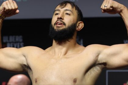 Dominick Reyes poses on the scale during the UFC Perth ceremonial weigh-in