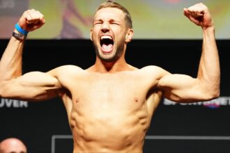 Reinier de Ridder poses on the scale at the UFC Vancouver ceremonial weigh-in